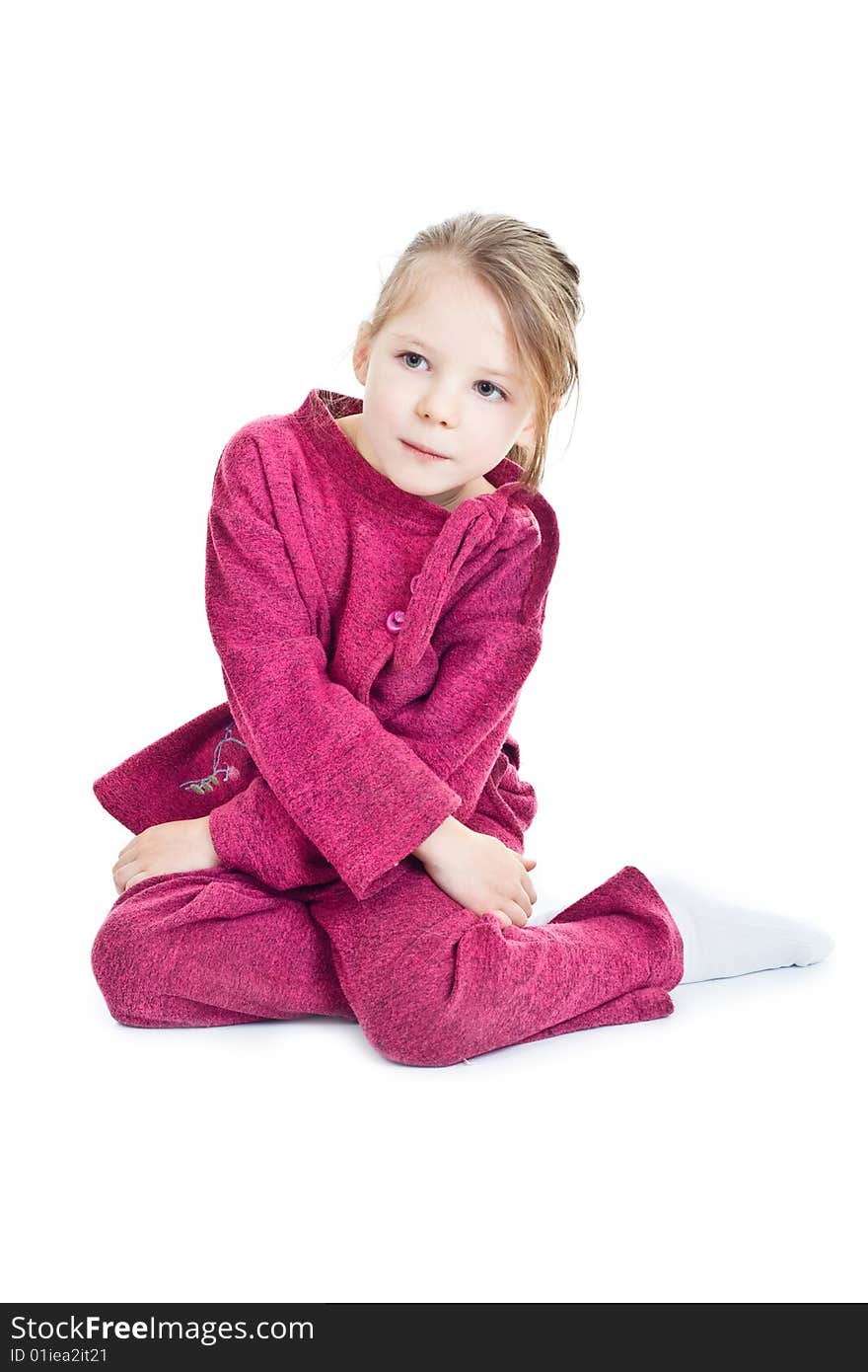 Sitting little girl in pirple dress