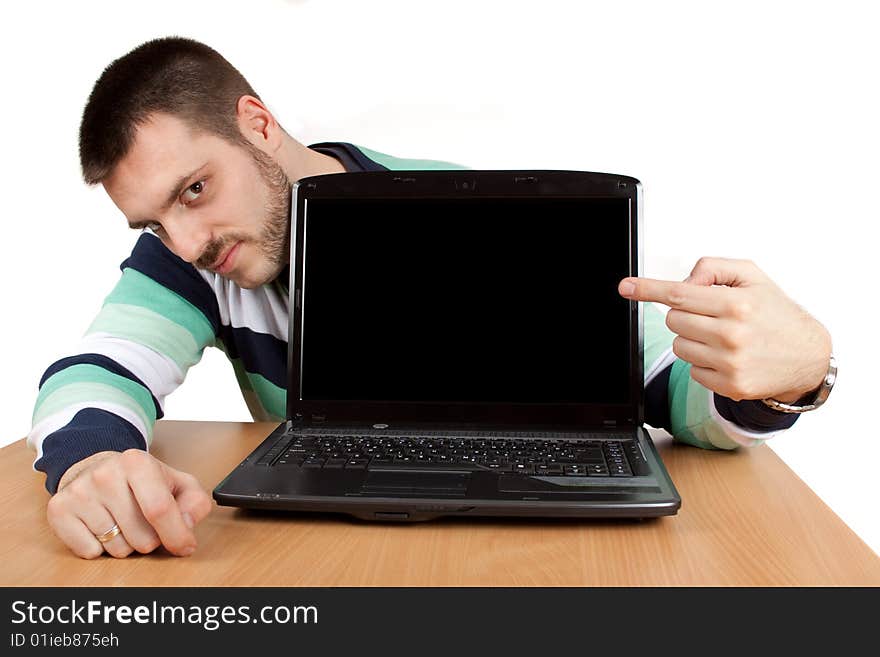 Young man showing what is on a notebook screen. Young man showing what is on a notebook screen