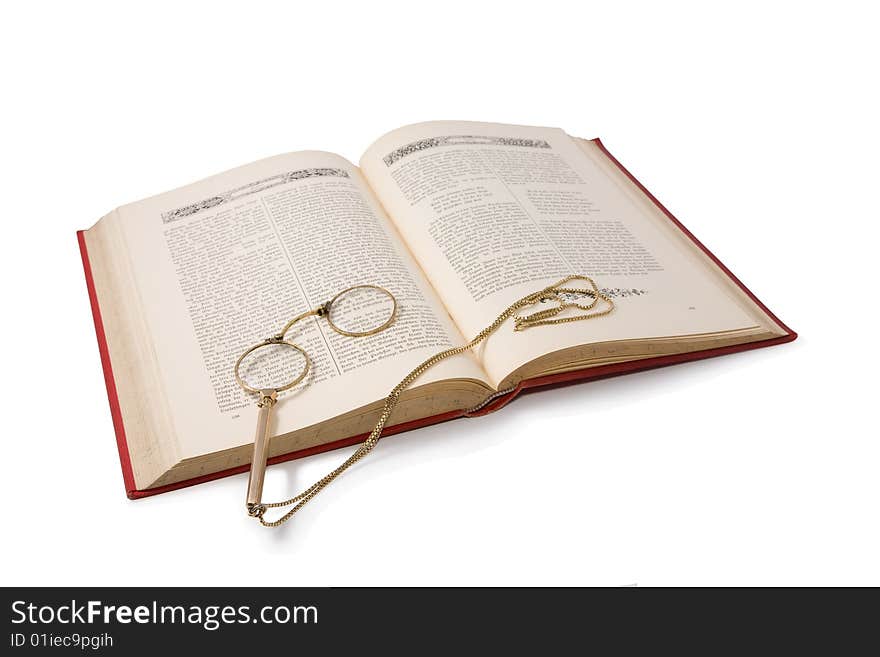 Vintage book and pince-nez. Isolated on white.