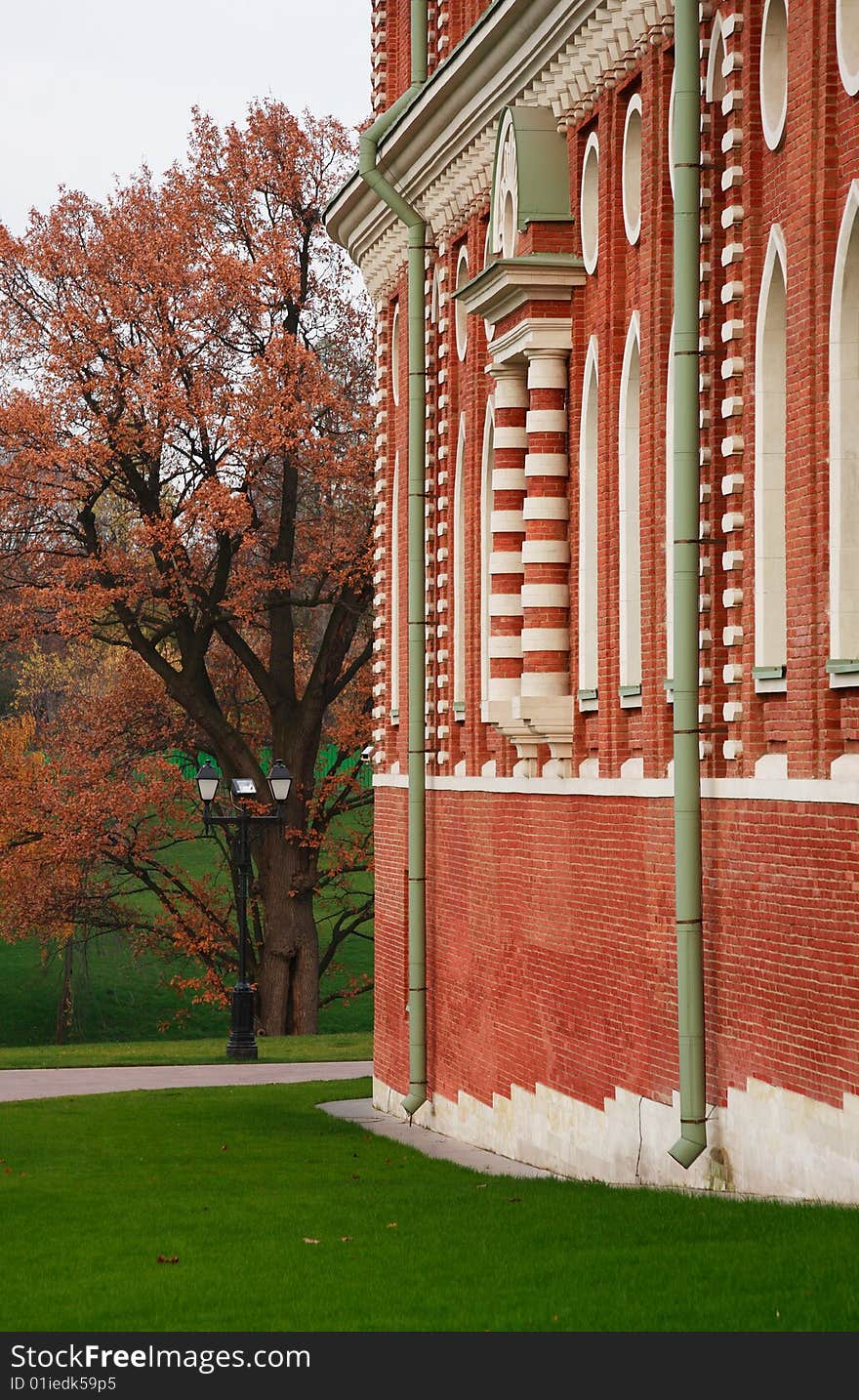 Fragment of an ancient building in autumn