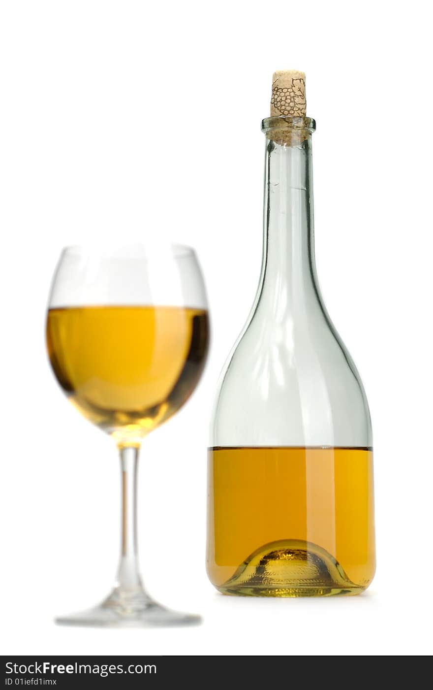 Glass and bottle of excellent white wine on a white background