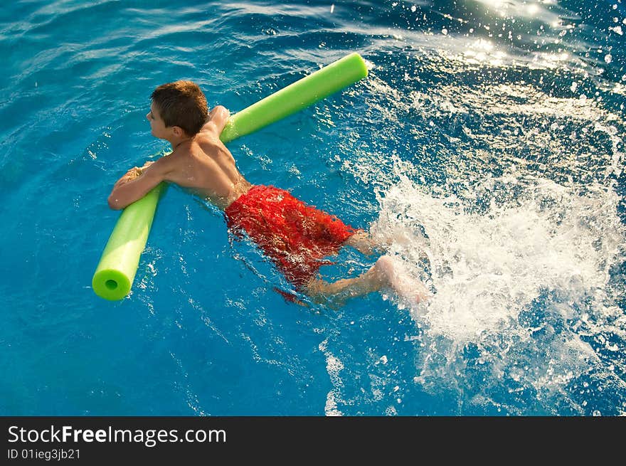 The boy swims in the pool. The boy swims in the pool