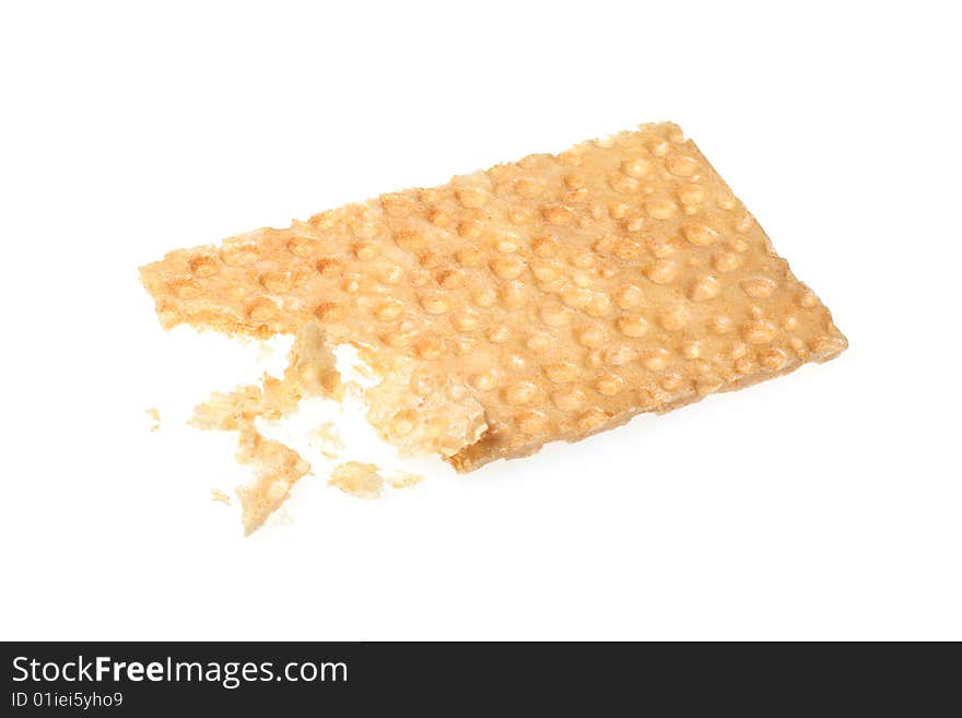 Bitten crispbread on a white background