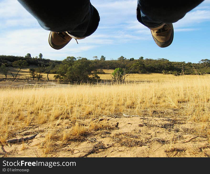 Feet Flying Over Desert