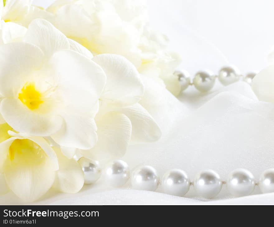 Close up of pearls and white flowers