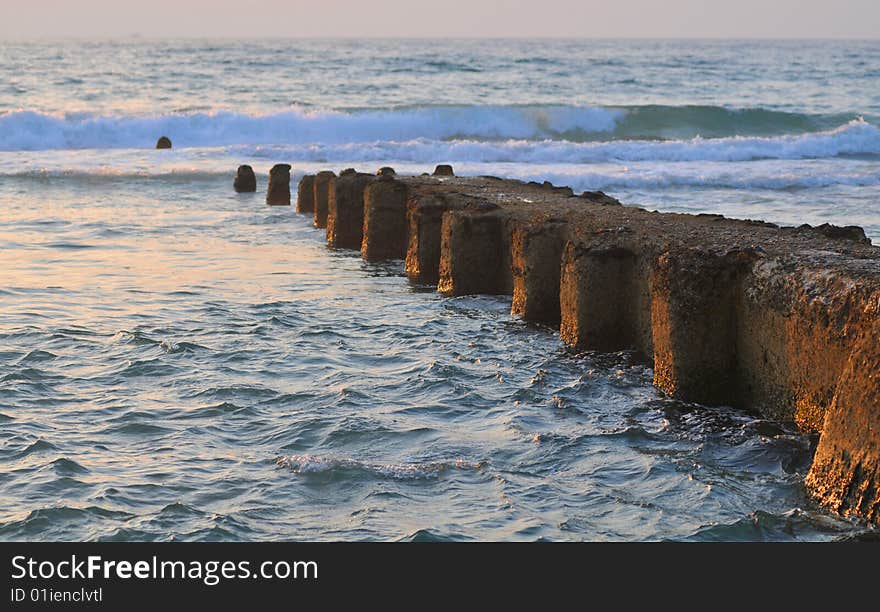 Jetty at twilight time lighten by sunset