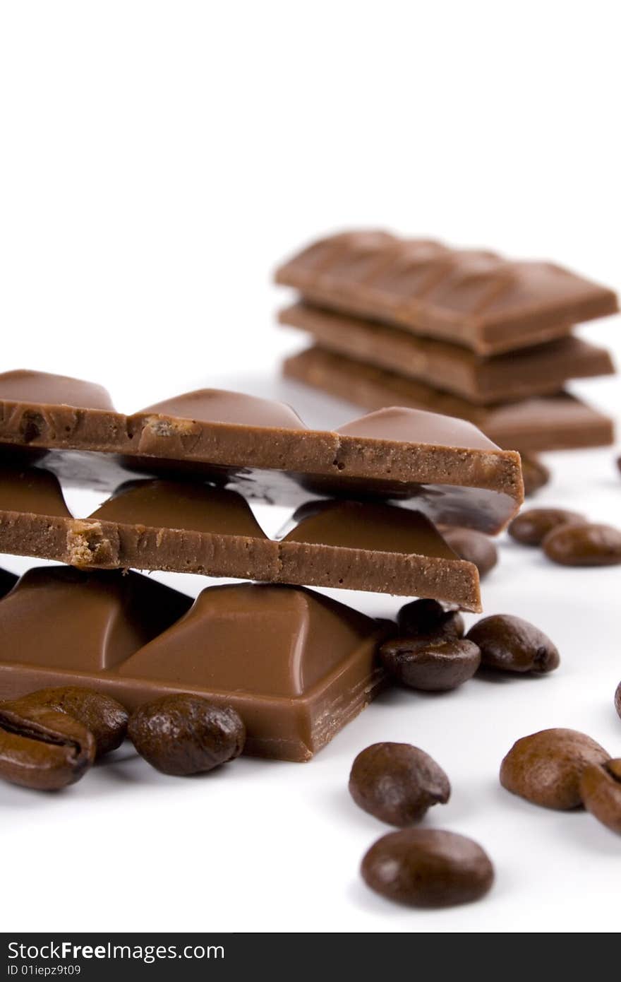 Chocolate and coffee beans on white background