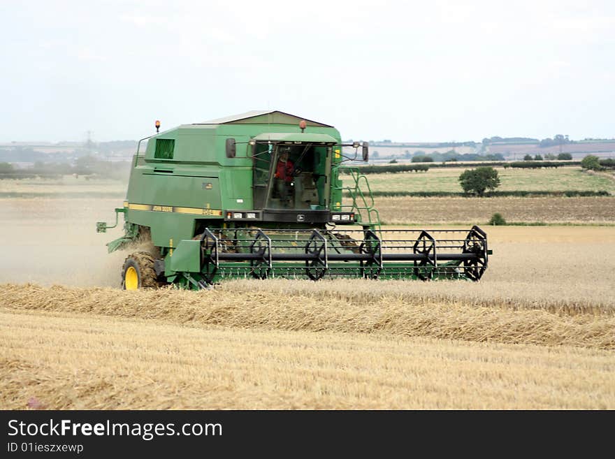 A combine harvester harvesting the field