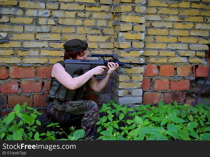 Shooting soldier in front of a wall. Shooting soldier in front of a wall