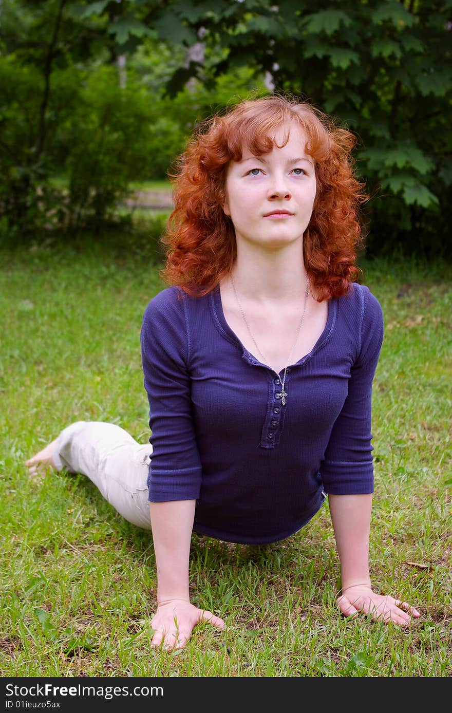 Young girl doing yoga on the nature