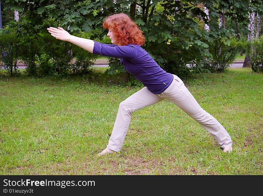 Young girl doing yoga on the nature