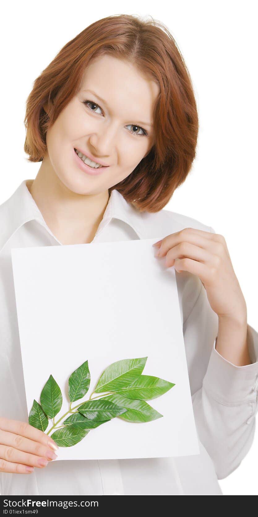 Smiling girl with a paper sheet and leaves of plants. Smiling girl with a paper sheet and leaves of plants.