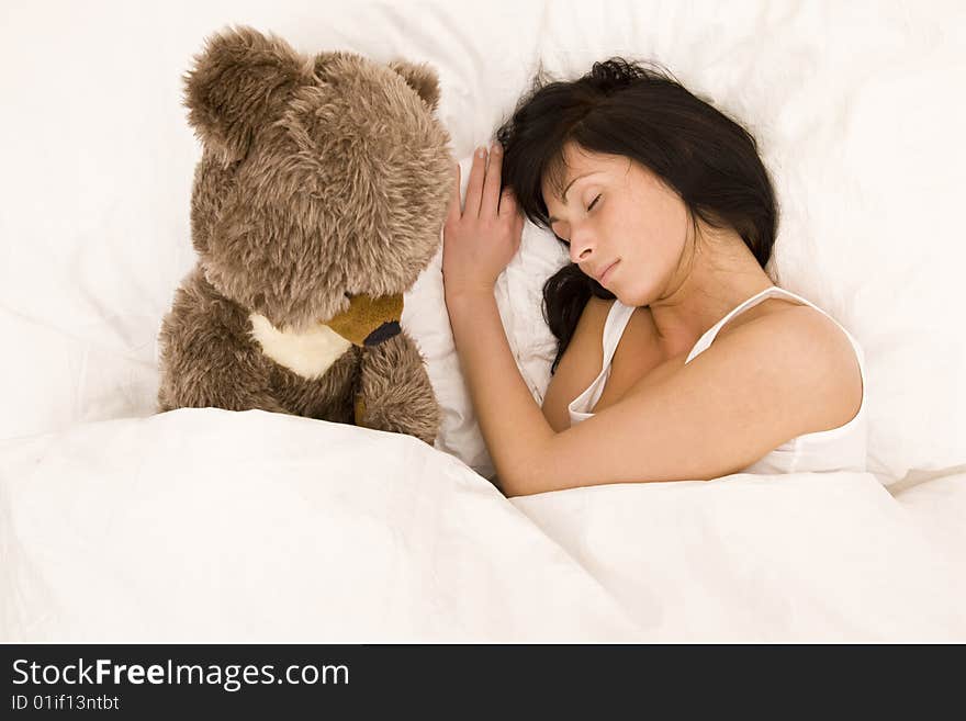 Woman sleeping in white bed. Woman sleeping in white bed