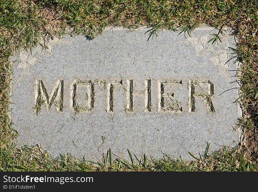 Mother inscription on old grunge granite tombstone. Mother inscription on old grunge granite tombstone.