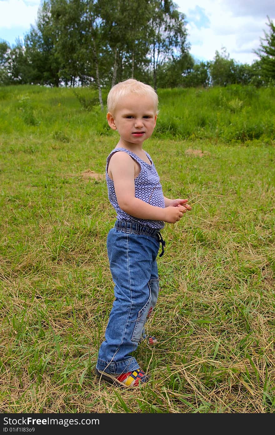 Angry boy standing in the field