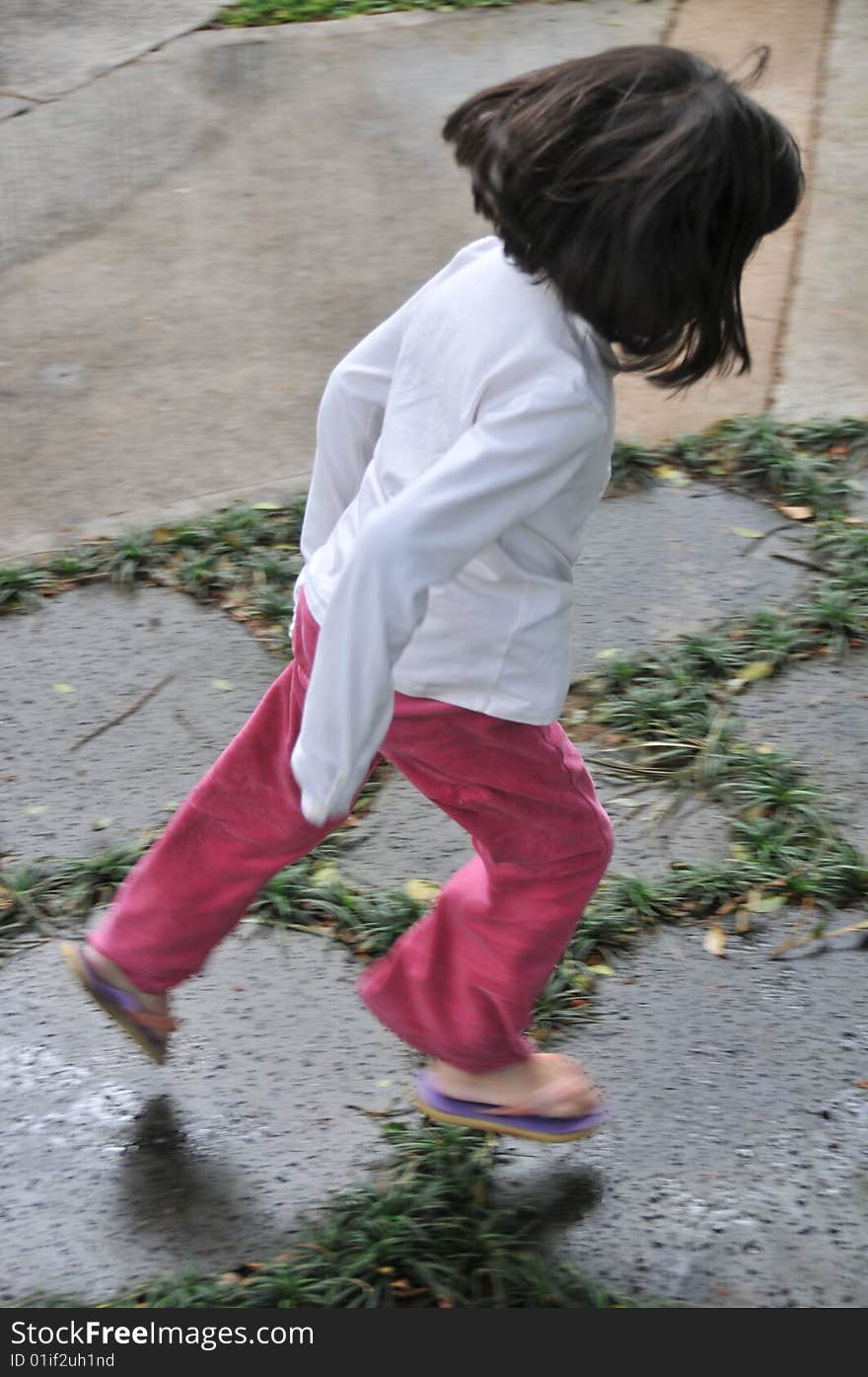 Jumping girl on stones