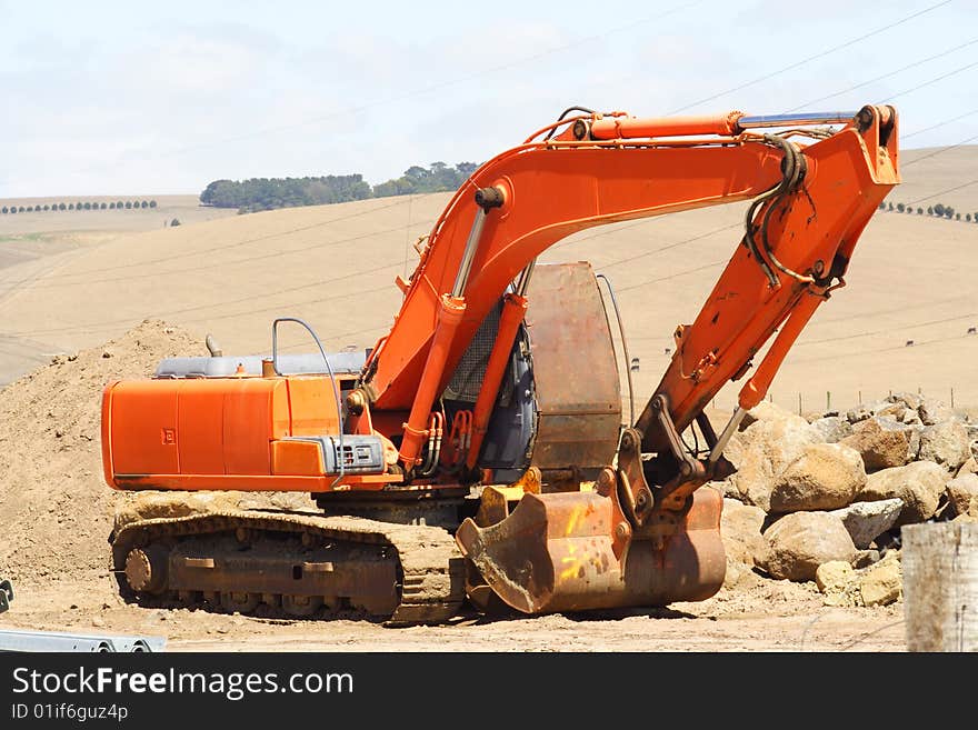 A Large orange earth mover. A Large orange earth mover