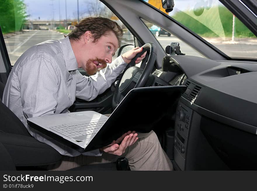 Driver using GPS laptop computer in a car