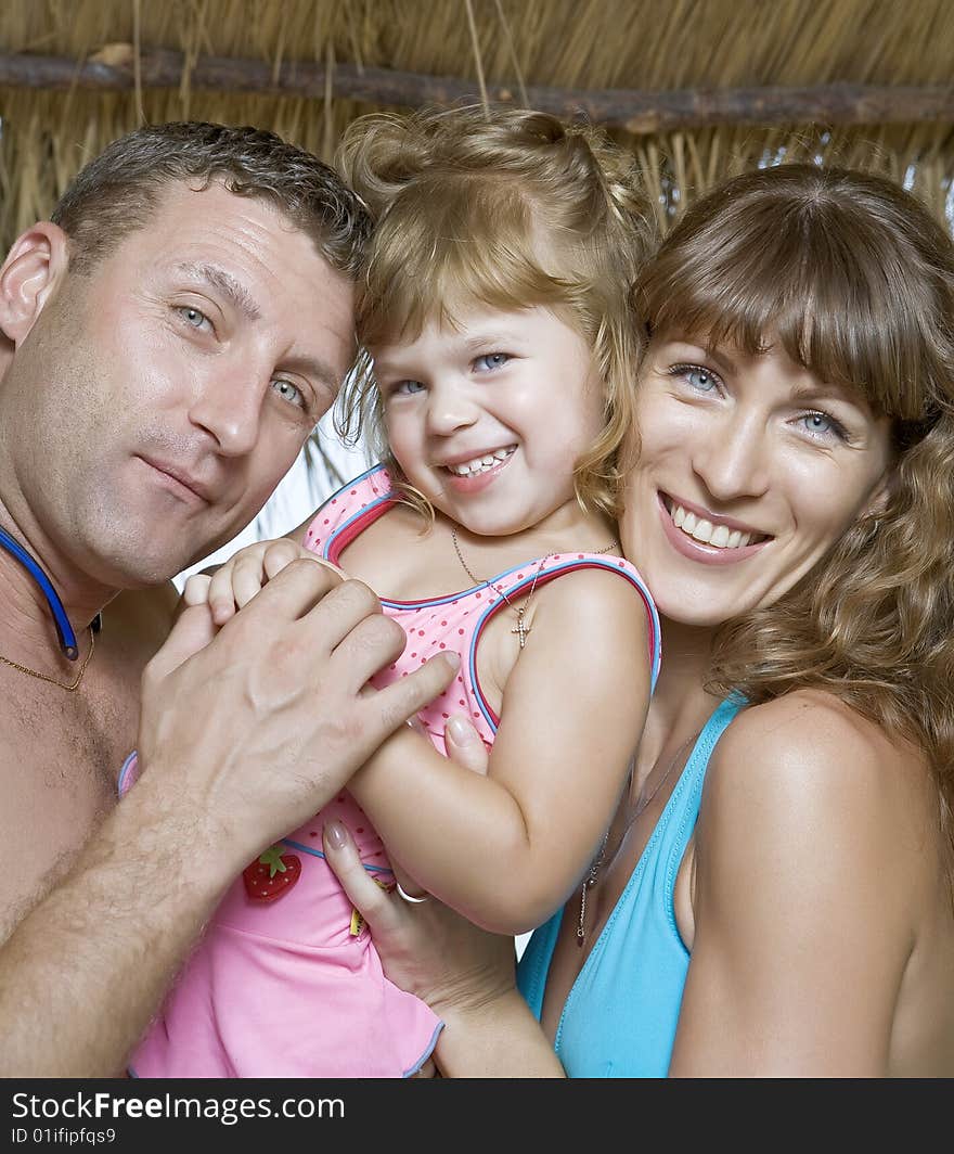 High key portrait of nice young family getting busy. High key portrait of nice young family getting busy