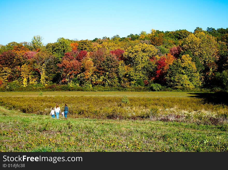 Mom and kids taking an Autumn walk