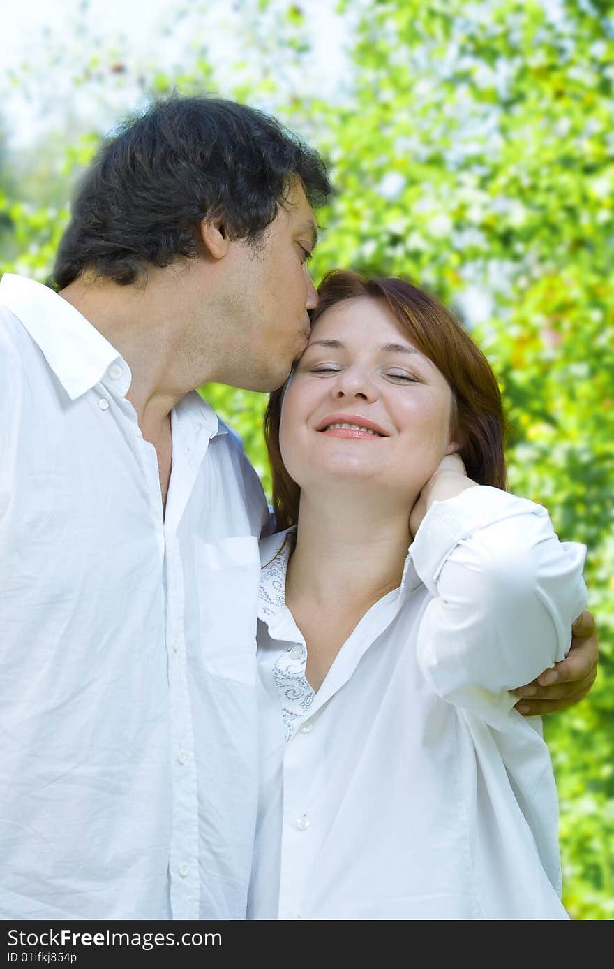 Portrait of young happy couple in summer environment. Portrait of young happy couple in summer environment