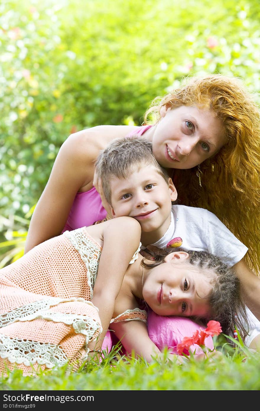 Portrait of little kids with mama  having good time in summer environment. Portrait of little kids with mama  having good time in summer environment