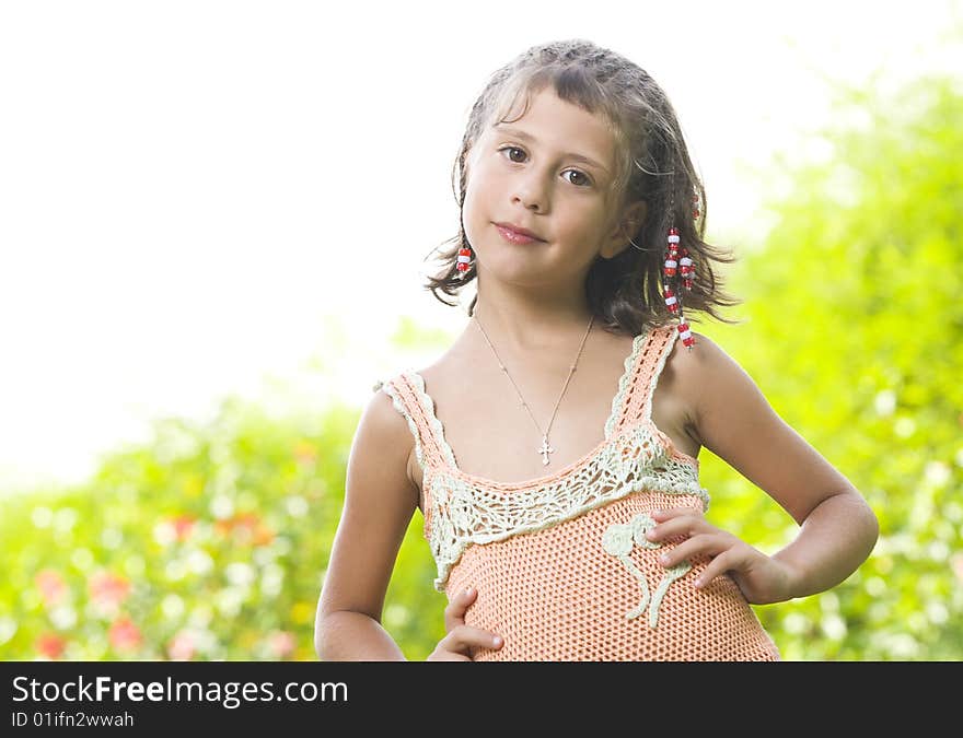 Portrait of little girl having good time in summer environment