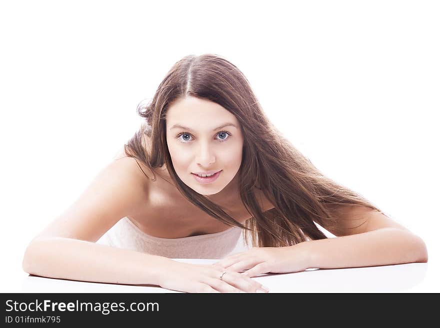 High key portrait of young woman on white back