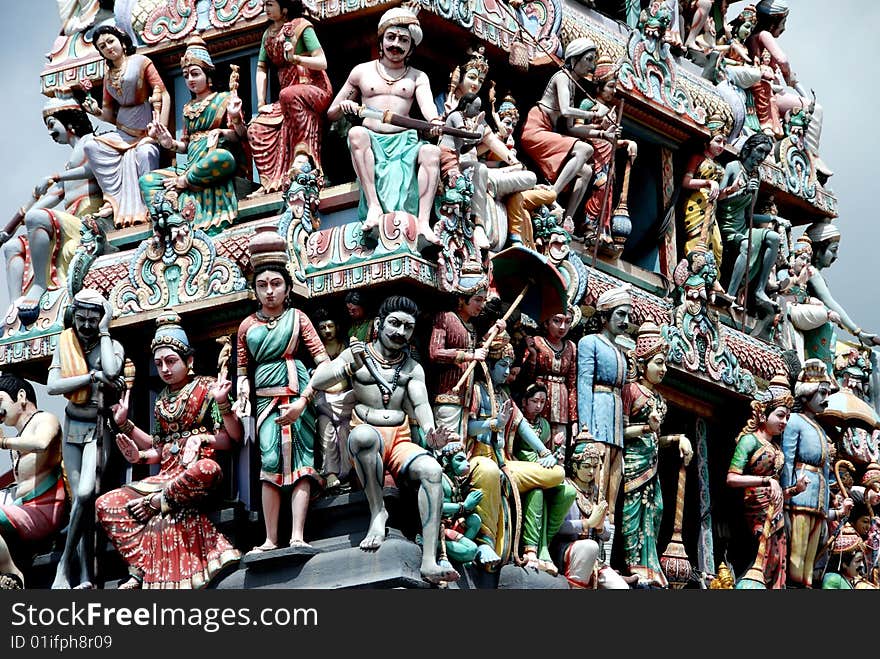 72 deities adorn the striking Sikhara tower above the entrance to 1827 Sri Mariamman Hindu Temple in Chinatown district of Singapore - Lee Snider Photo. 72 deities adorn the striking Sikhara tower above the entrance to 1827 Sri Mariamman Hindu Temple in Chinatown district of Singapore - Lee Snider Photo.