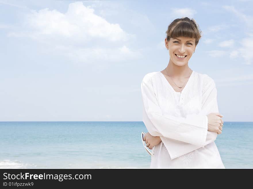 Portrait of nice young woman having good time on the beach. Portrait of nice young woman having good time on the beach