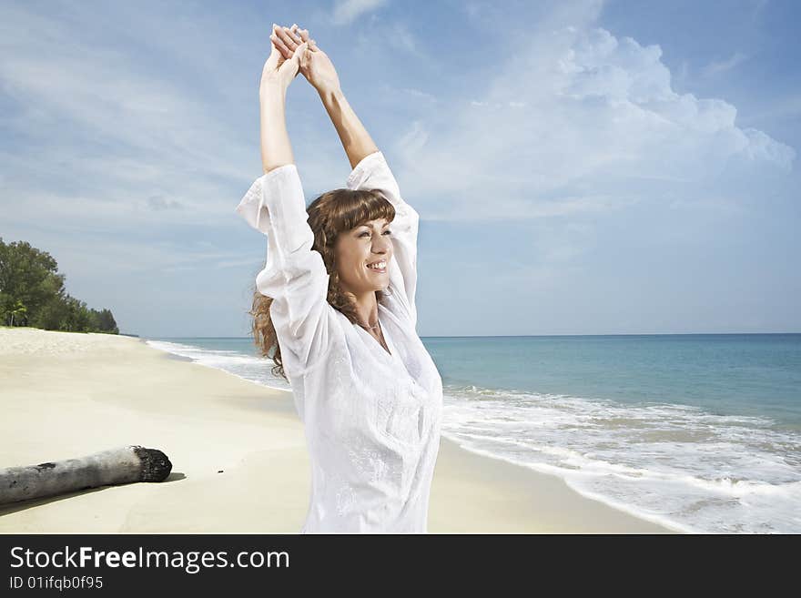 Portrait of nice young woman having good time on the beach. Portrait of nice young woman having good time on the beach