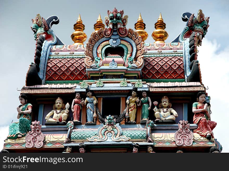 The extrordinary Amalaka bulbous cushion-shaped roof finial atop the Sikhara tower at the 1827 Sri Mariamman Hindu Temple in the Chinatown district of Singapore - Lee Snider Photo. The extrordinary Amalaka bulbous cushion-shaped roof finial atop the Sikhara tower at the 1827 Sri Mariamman Hindu Temple in the Chinatown district of Singapore - Lee Snider Photo.