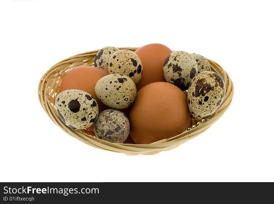 Crude eggs in basket isolated on a white background