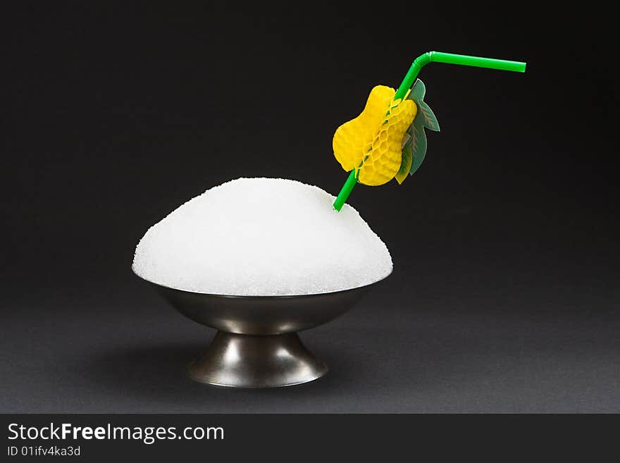 Snow in a cup for ice-cream isolated on a black background. Snow in a cup for ice-cream isolated on a black background