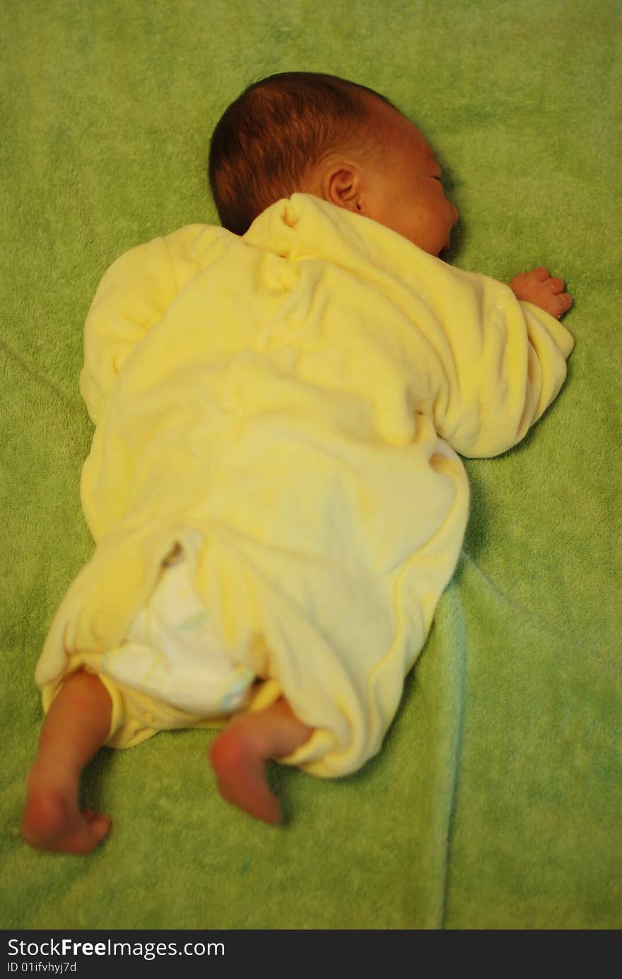 Cute newborn baby boy lie prostrate on bed. Cute newborn baby boy lie prostrate on bed