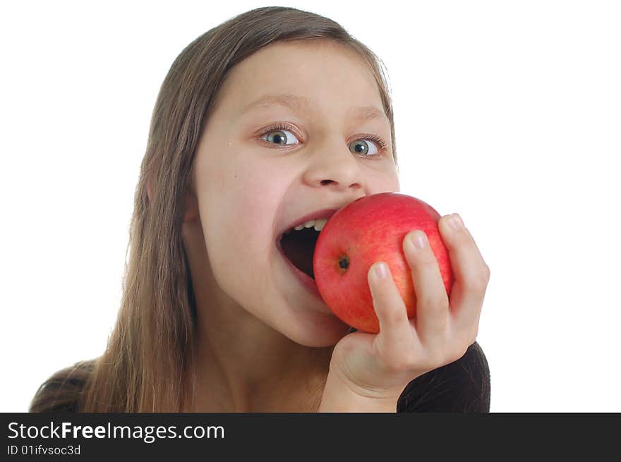 The cute little girl eating the apple. The cute little girl eating the apple