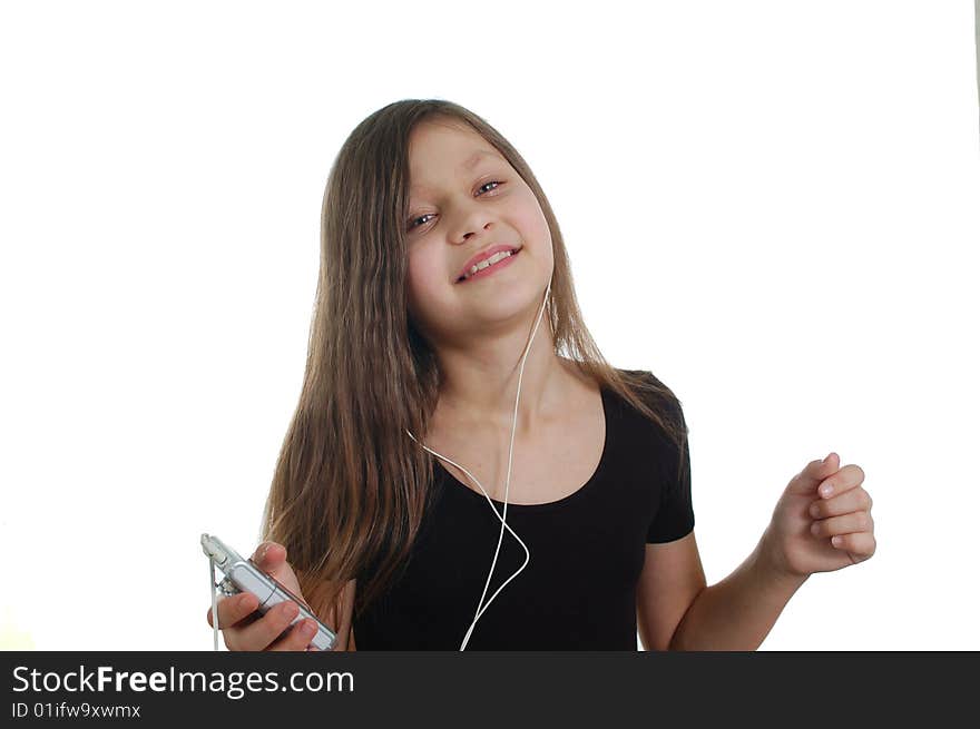 The little cute girl listen the music(holding the pleer )