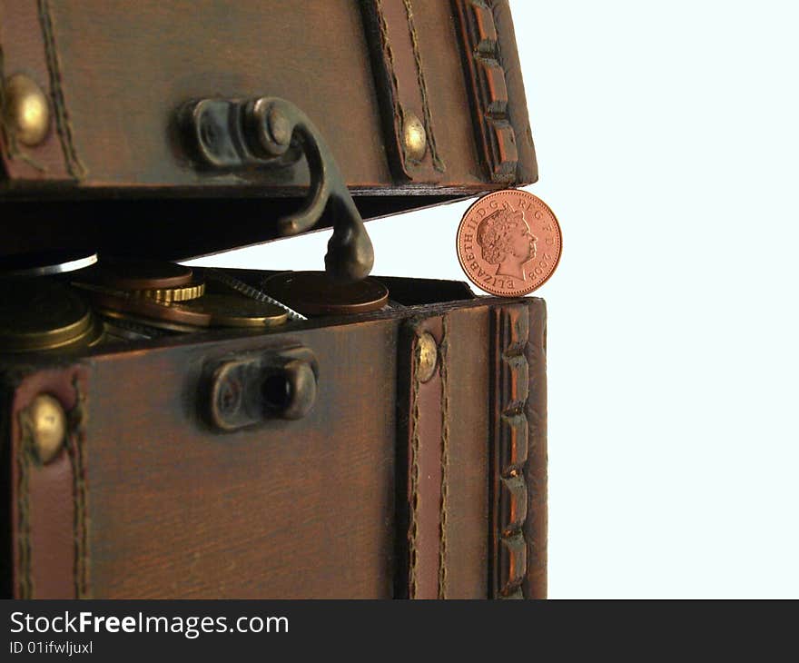 Ancient trunk with coins on a white background. Ancient trunk with coins on a white background.