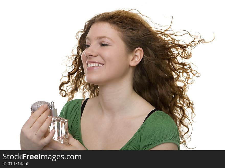 Red haired teenager with perfume, pleasant smell for the personal hygiene