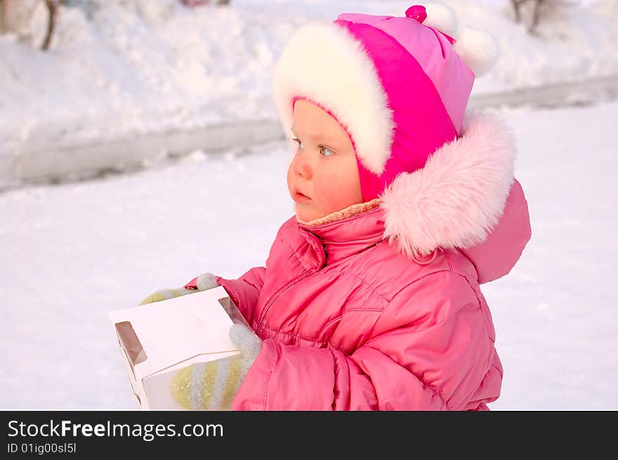 Pretty little girl with candy box.