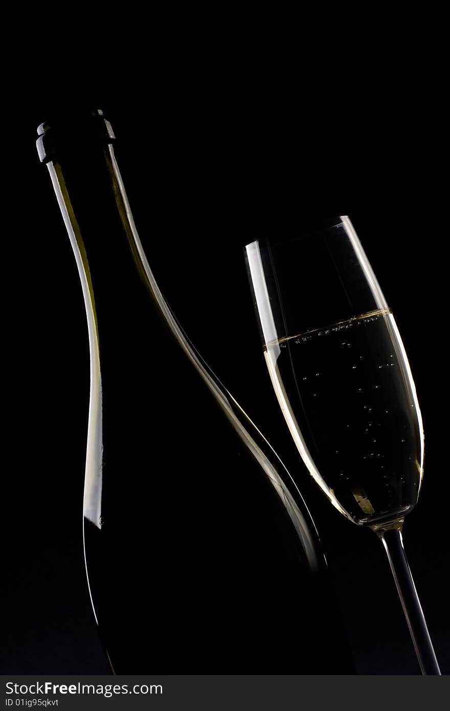 Champagne glass on black background