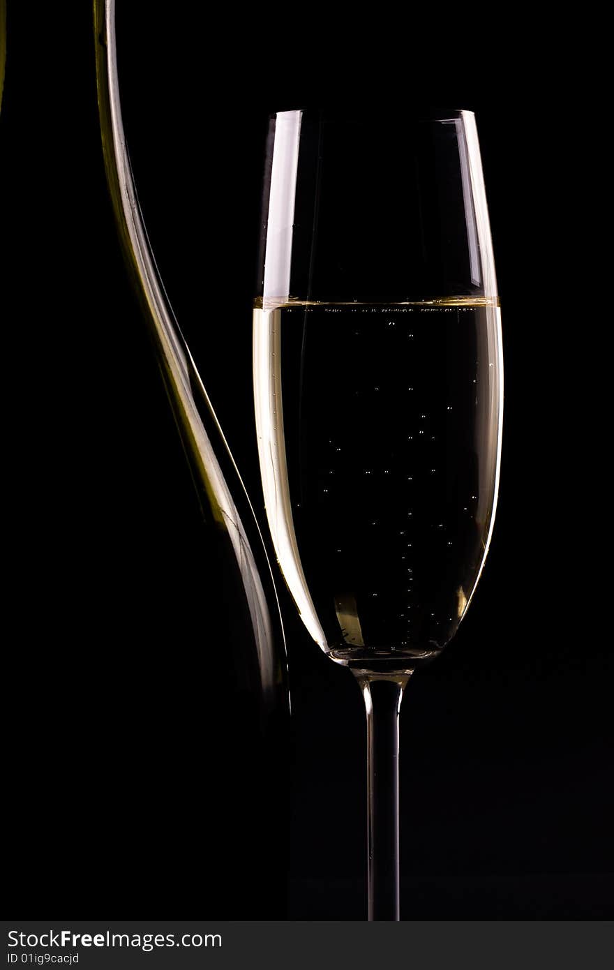 Champagne glass on black background