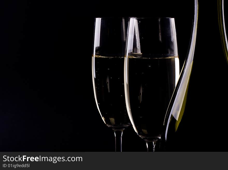 Champagne glass on black background