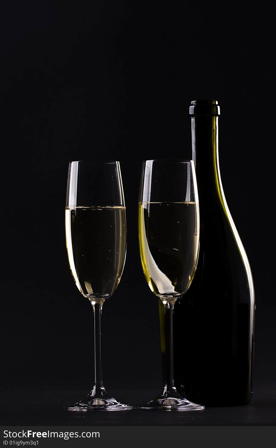 Champagne glass on black background