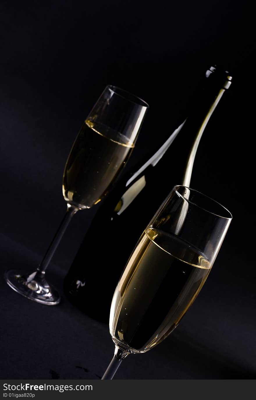 Champagne glass on black background