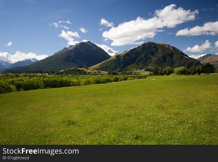 Spring Landscape Green Meadow with Mountains. Spring Landscape Green Meadow with Mountains