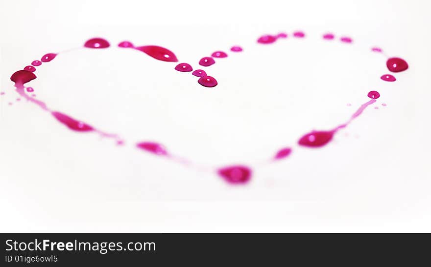 Pink heart made of water drops