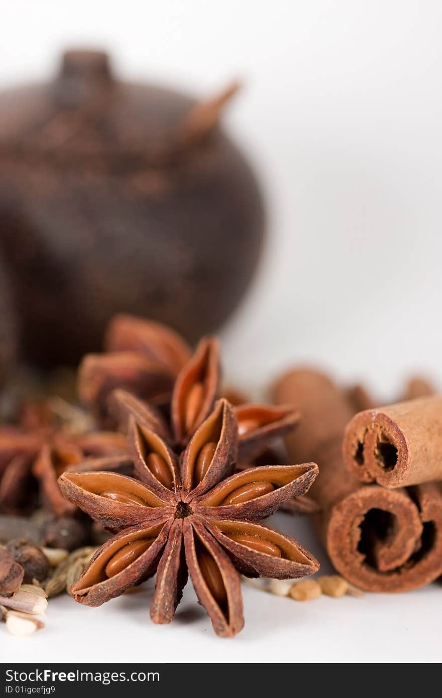 Spices & wooden jars. focus on star anise.