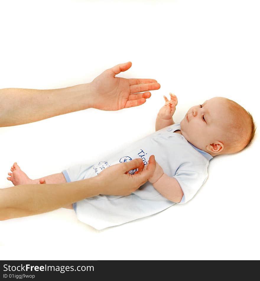 Baby and parent's hands over white