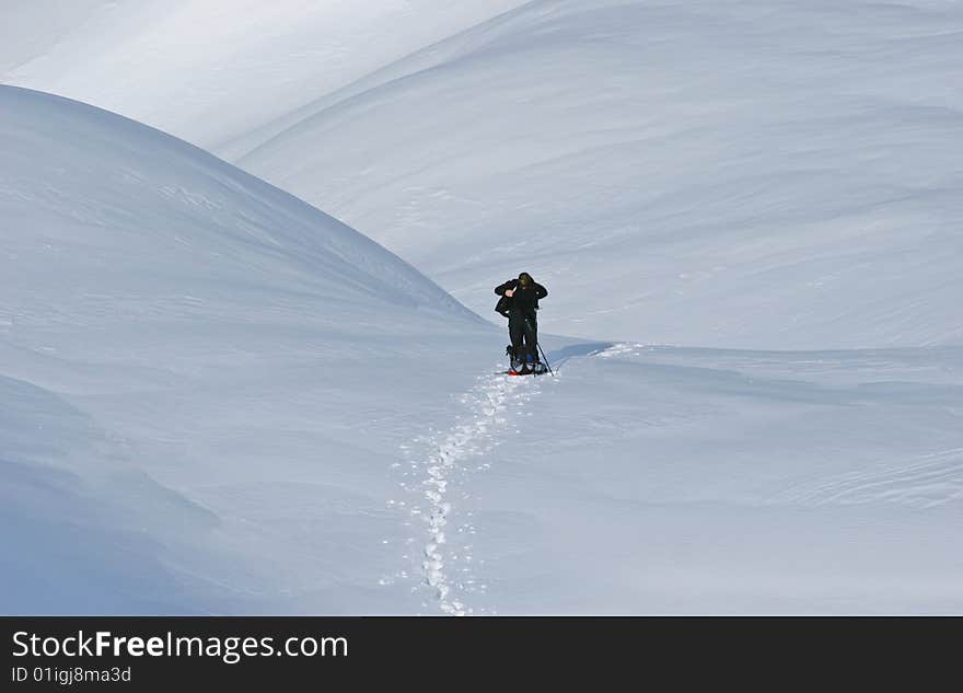 Woman mountainering alone in snow